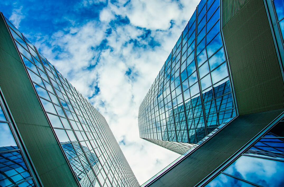 Modern glass office building seen from below