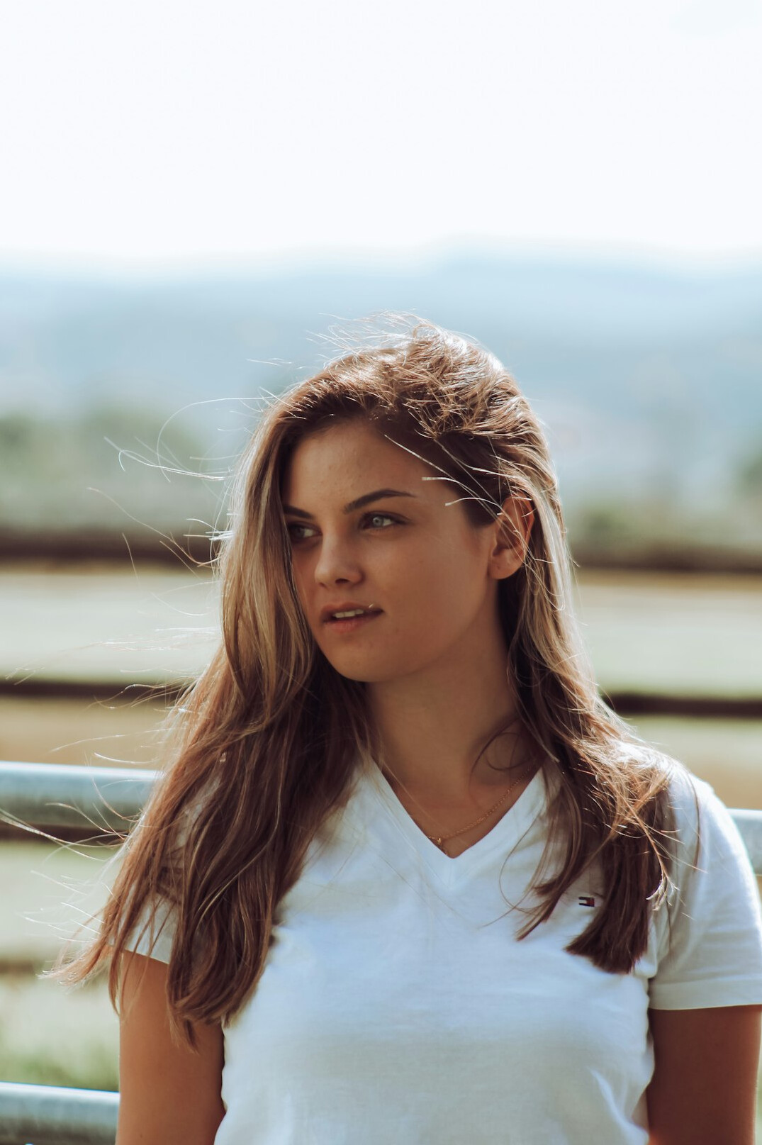 Portrait of a young woman with long hair smiling